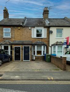 a house with a parking lot in front of it at Royal Retreat & Lego Lodge in London