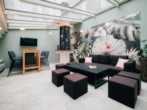 a living room with a couch and a table at Hotel Krone Thun in Thun