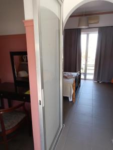 a room with a door leading to a bedroom at GOLDEN BEACH in Souvala