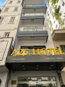 a hour hotel sign on the side of a building at A25 Hotel - 14 Hồ Huấn Nghiệp in Ho Chi Minh City