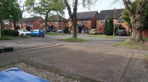 a street with houses and a parking lot at Spacious 4 bed Farnborough AirShow in Blackwater