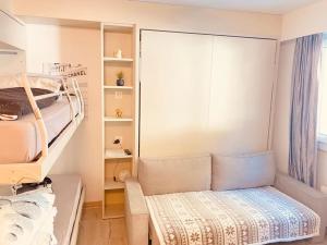 Postel nebo postele na pokoji v ubytování Crans Montana - Studio au pied du téléphérique