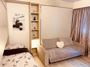 Postel nebo postele na pokoji v ubytování Crans Montana - Studio au pied du téléphérique