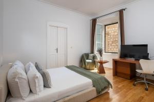 Posteľ alebo postele v izbe v ubytovaní Blasius Residence