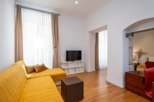 Televízia a/alebo spoločenská miestnosť v ubytovaní Blasius Residence