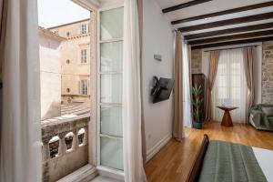 Posteľ alebo postele v izbe v ubytovaní Blasius Residence