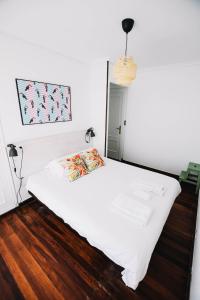 Postel nebo postele na pokoji v ubytování Loredo Surf House