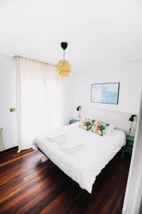 Postel nebo postele na pokoji v ubytování Loredo Surf House