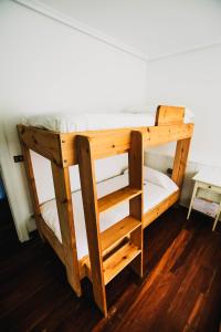 Postel nebo postele na pokoji v ubytování Loredo Surf House