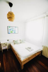 Postel nebo postele na pokoji v ubytování Loredo Surf House