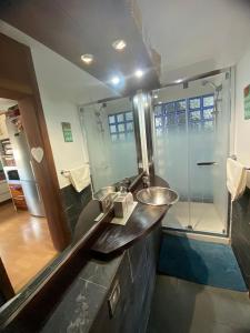 a bathroom with a sink and a shower at Apartamento caracol in Los Abrigos