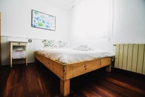 Postel nebo postele na pokoji v ubytování Loredo Surf House