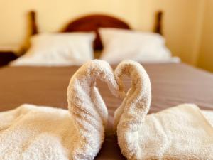 A bed or beds in a room at Belle Vue