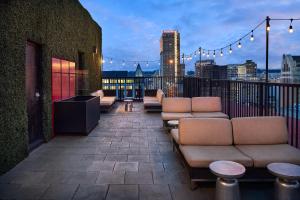 a balcony with couches and lights on a building at Redmont Hotel Birmingham - Curio Collection by Hilton in Birmingham