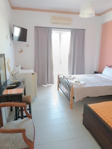 Postel nebo postele na pokoji v ubytování GOLDEN BEACH