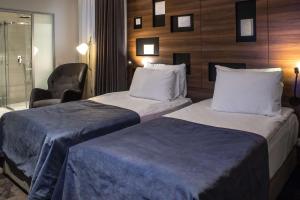 Postel nebo postele na pokoji v ubytování Best Western Premier Natalija Residence