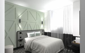 Habitación blanca con cama y escritorio en Logis Hotel Darcy Dijon Centre, en Dijon