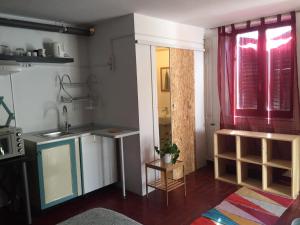 a kitchen with a sink and a counter top at Studio Cotta, Salara farmhouse in Koper
