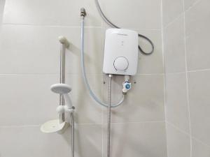 a shower in a bathroom with a hand held shower at 1056 Hijayu Seremban in Seremban +31 photos