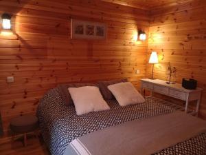 Ένα ή περισσότερα κρεβάτια σε δωμάτιο στο Chalet bois 45M2