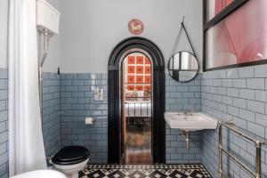 a bathroom with a toilet and a sink at Magic Moments - London Bridge - by Frankie Says in London