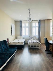 a living room with two beds and a couch at Kael Apartman 02 in Teplice