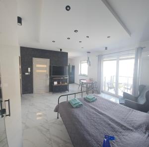 Posteľ alebo postele v izbe v ubytovaní Apartament Malta