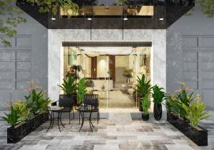 a lobby of a building with plants at Baglioni Signature in Ho Chi Minh City