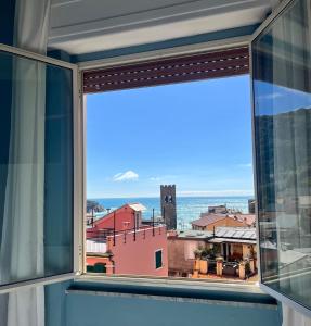 a view of the ocean from a window at Albergo Degli Amici in Monterosso al Mare