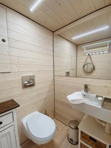 a bathroom with a toilet and a sink at Waterfront Loft in Brandenburg an der Havel
