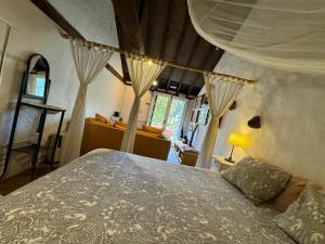 a bedroom with a bed in a room with curtains at Finca La Principal in Breña Alta