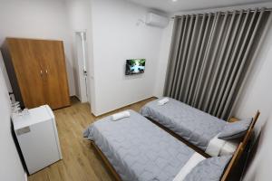 Ένα ή περισσότερα κρεβάτια σε δωμάτιο στο Guesthouse Aurel