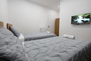 Ένα ή περισσότερα κρεβάτια σε δωμάτιο στο Guesthouse Aurel