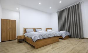 Ένα ή περισσότερα κρεβάτια σε δωμάτιο στο Guesthouse Aurel
