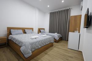 Ένα ή περισσότερα κρεβάτια σε δωμάτιο στο Guesthouse Aurel