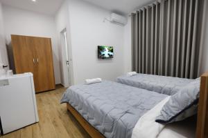 Ένα ή περισσότερα κρεβάτια σε δωμάτιο στο Guesthouse Aurel