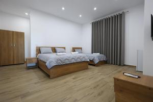 Ένα ή περισσότερα κρεβάτια σε δωμάτιο στο Guesthouse Aurel