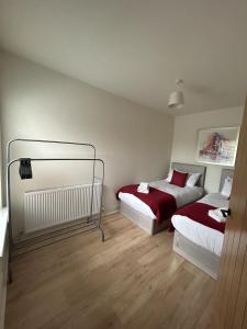 a bedroom with two beds in a room at Kensington Park in Reading