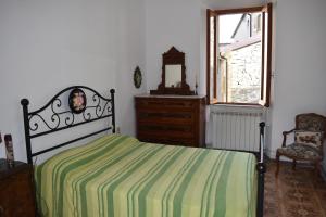 Postel nebo postele na pokoji v ubytování Casa di Alice