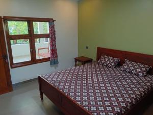 Ένα ή περισσότερα κρεβάτια σε δωμάτιο στο Mango Guesthouse