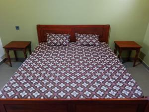 Ένα ή περισσότερα κρεβάτια σε δωμάτιο στο Mango Guesthouse