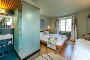Uma cama ou camas num quarto em Hotel an der Aare Swiss Quality