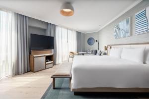 a bedroom with a large bed and a television at JW Marriott Hotel Mexico City Polanco in Mexico City