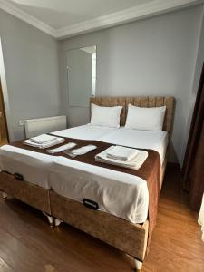 A bed or beds in a room at Tavra hotel