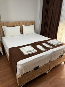 A bed or beds in a room at Tavra hotel
