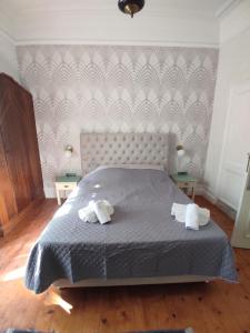 En eller flere senger på et rom på Villa Melina