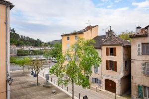 a view of a street in a city with buildings at Nationale 202 CahorsCityStay in Cahors