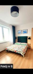 Una cama o camas en una habitación de Pokoje Gościnne Gąsowscy Dzieci od 12 roku życia