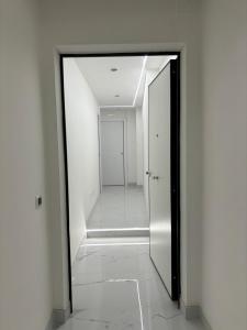 a hallway with a mirror and a door in a building at Tiburtina Flats in Rome