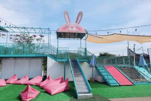 a playground with a slide and a bunny on it at See Sky Resort in Ban Sao Thong